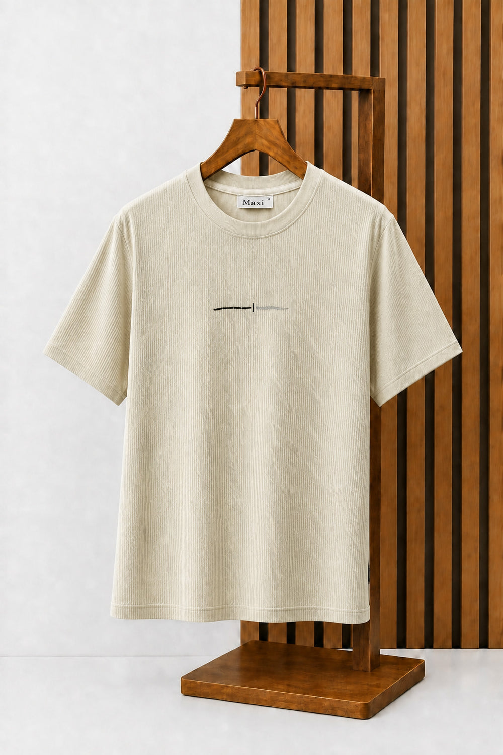 Line Graphic Ribbed Tee in Sand, on a wooden hanger