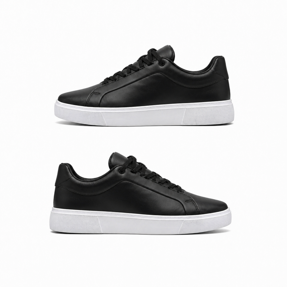 Black leather sneakers with a white sole, side view